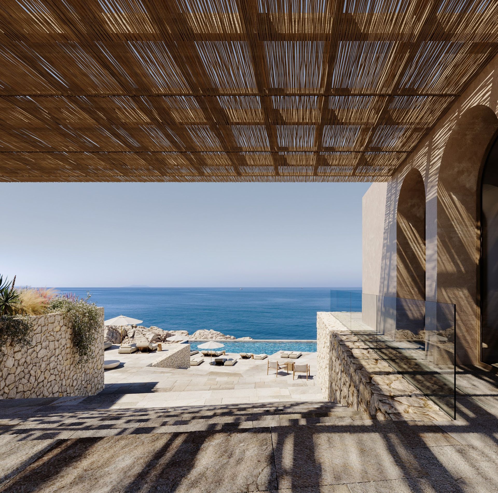 View to the sea from under a reed and timber pergola