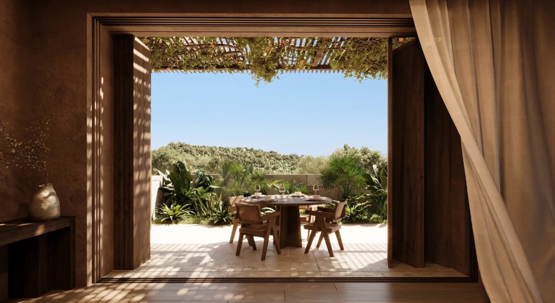 Living room of a boutique villa north: timber screens folded back onto a shaded terrace with a dining table