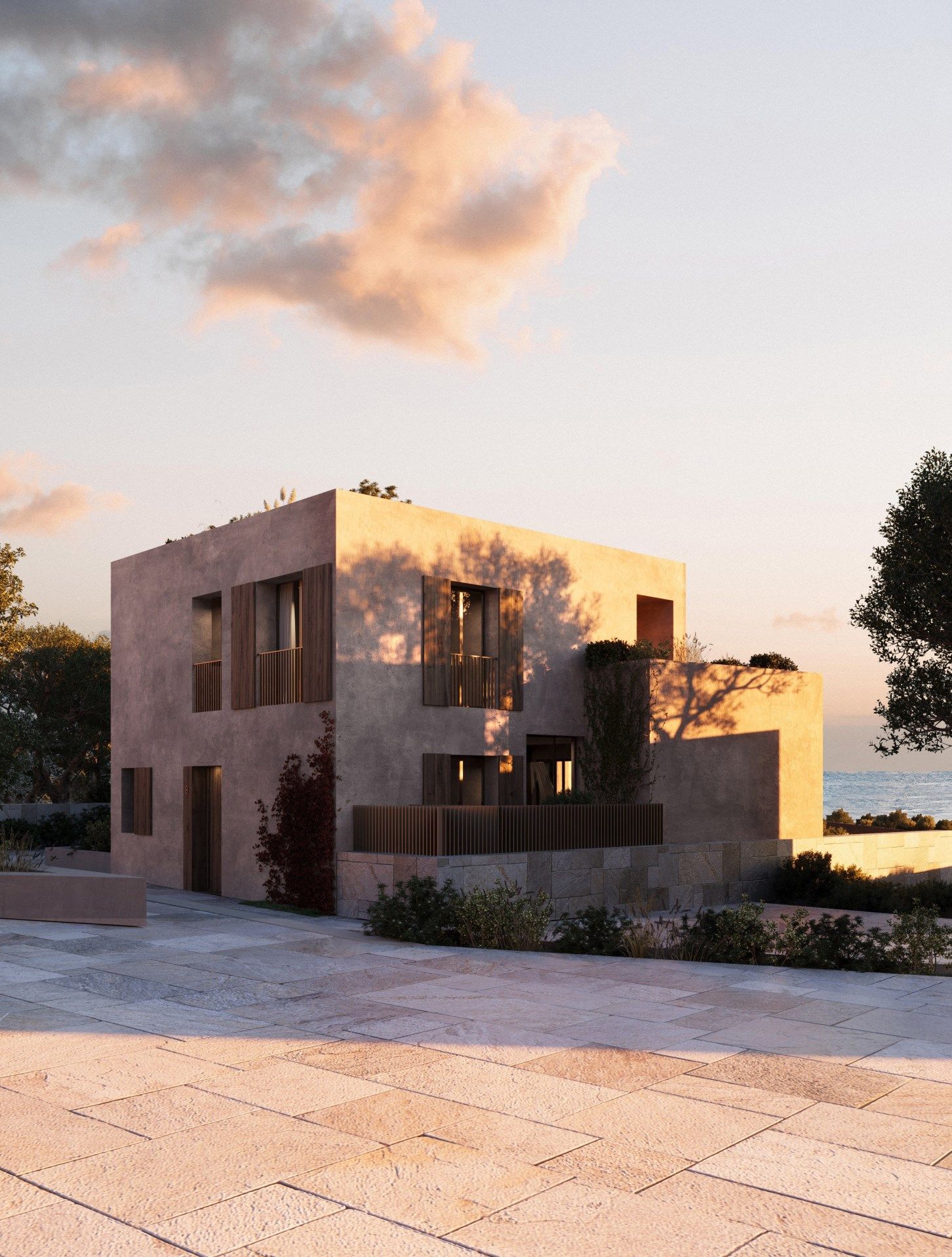 Boutique villa south at sunset, seen from the stone forecourt